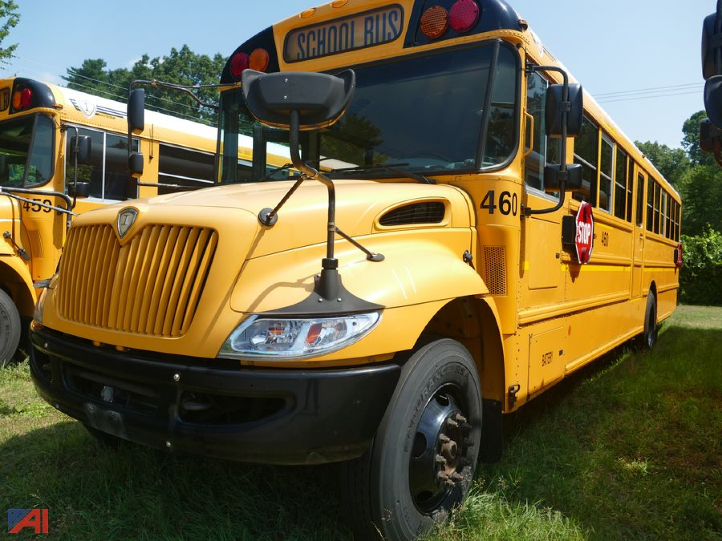 School bus 2019 International CE 3000 side view showing yellow body and 'SCHOOL BUS' sign on top front window.