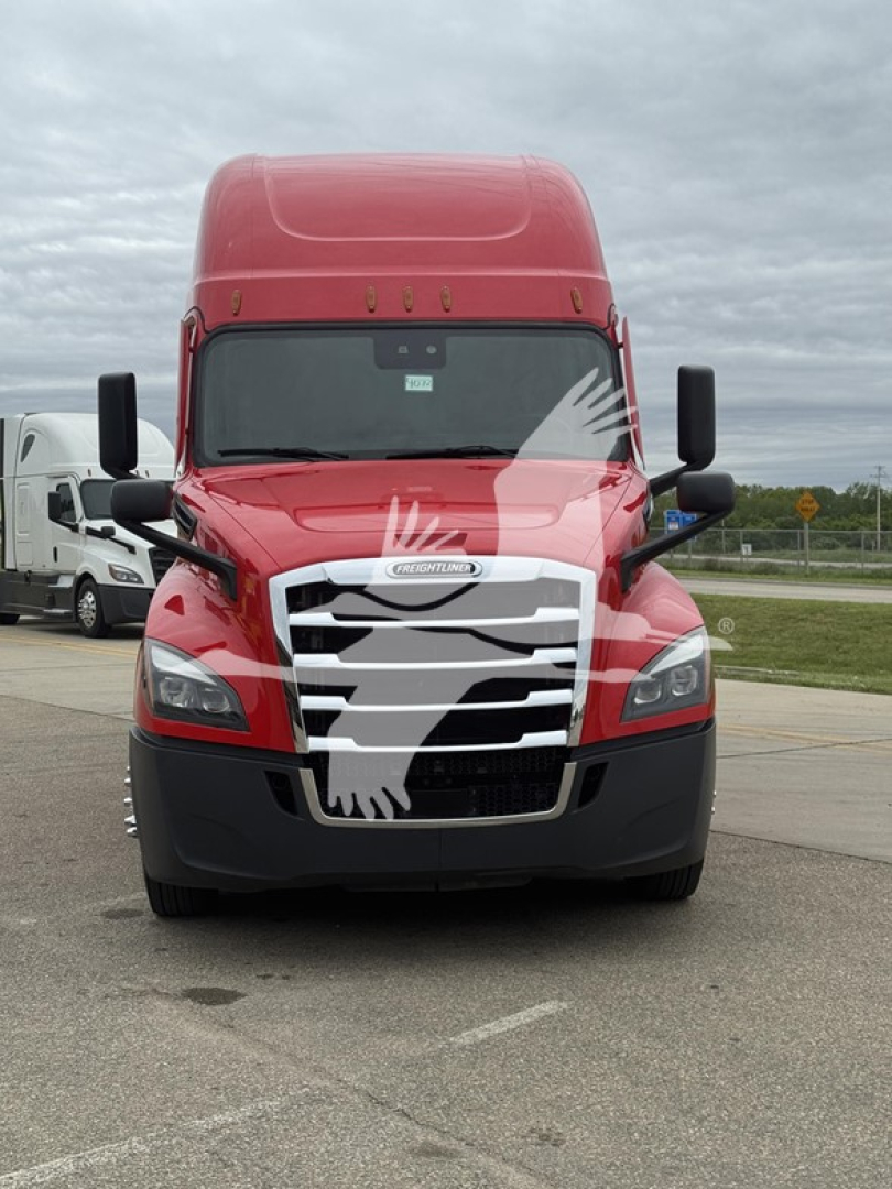 Truck front view showing red Freightliner Cascadia 126 with large grille and black bumper; clear windshield, side mirrors, and cab top fairing.