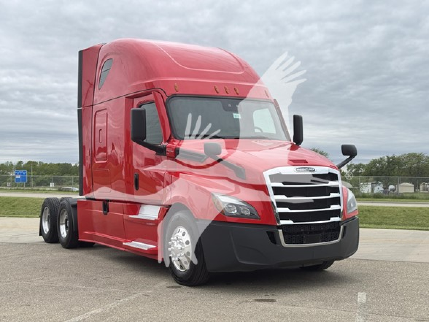 Freightliner Cascadia 126 heavy-duty truck in red, three-quarter view, sleeper cab, front grille and headlights visible.
