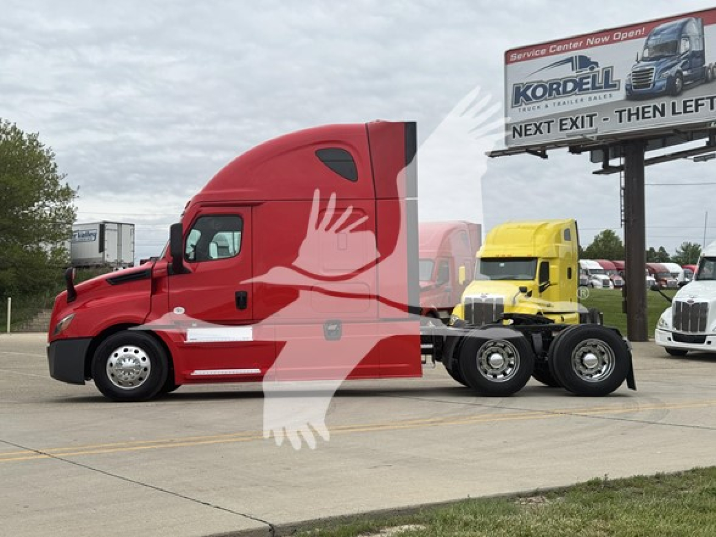Freightliner Cascadia 126 truck tractor in red with sleeper cab, side view showing chassis and fifth wheel.
