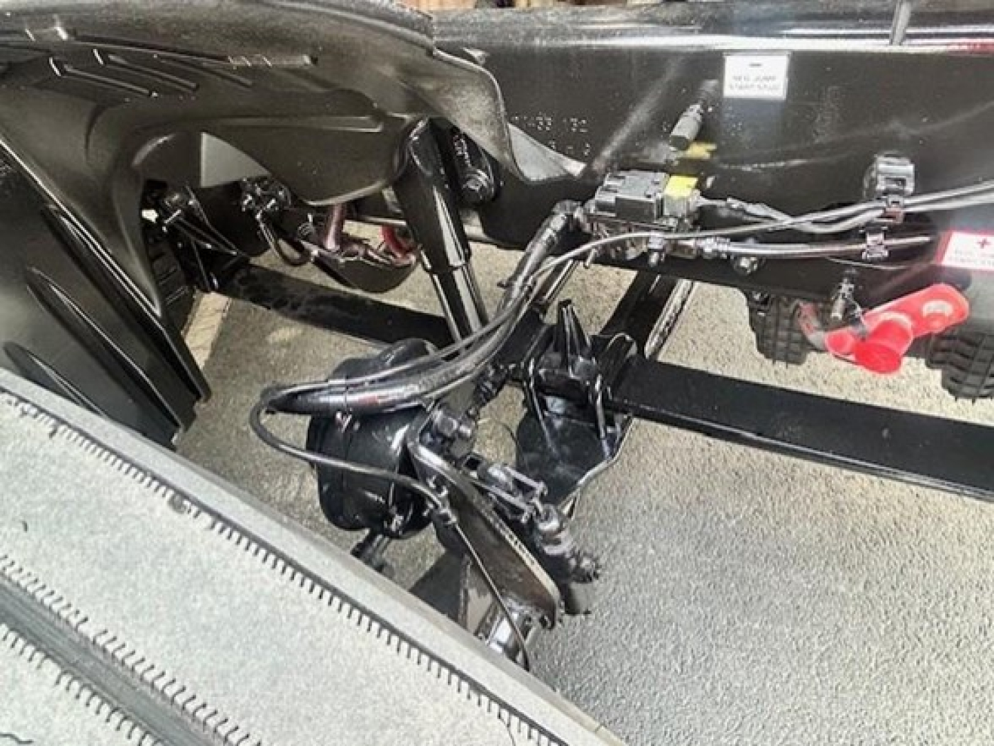Front view under Freightliner Cascadia 126 frame showing air lines and suspension components.