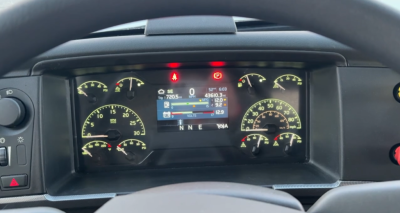 Dashboard display of a Volvo VNR300 day cab showing instrument cluster with multiple gauges and a central digital readout.