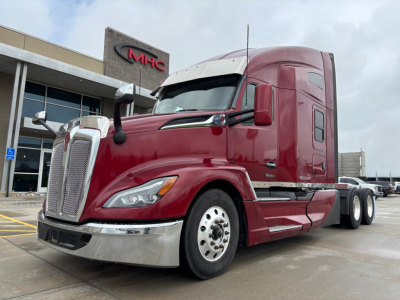 Kenworth T680 2023 model truck in maroon color, front-left view, with sleeper cab and chrome bumper.