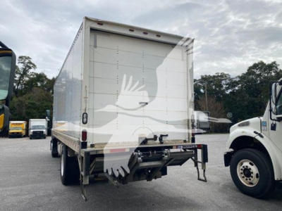 Isuzu box truck rear view showing back doors and undercarriage hardware. Visible text not legible due to watermark.