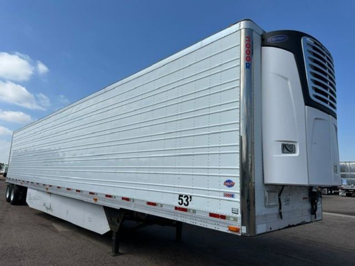 Utility reefer trailer with a Thermo King front unit showing 53' length and metal panel sides.