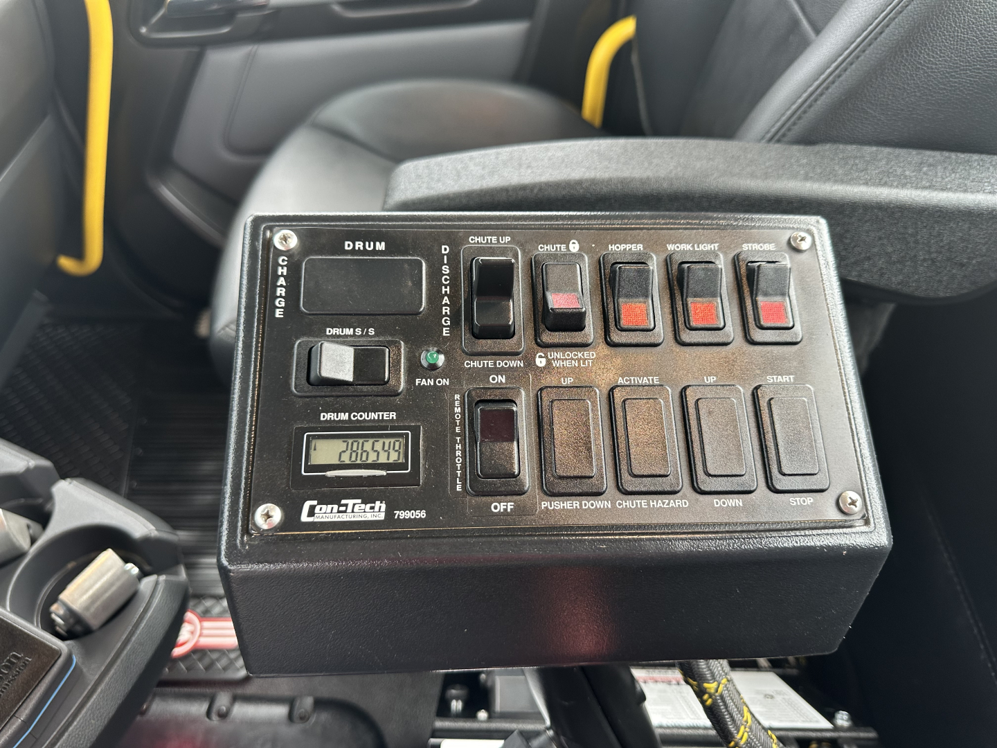 Kenworth mixer truck control panel with labeled switches and digital readout showing 28,654 hours.