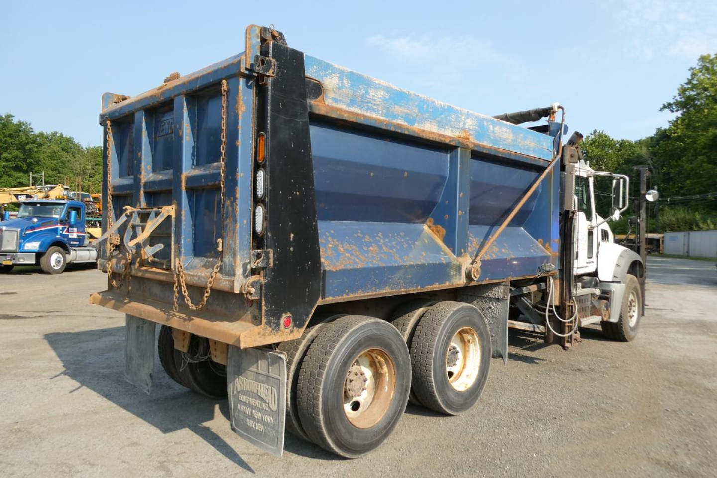 Dump truck bed of a 2008 Mack GU713 in service condition showing blue dump body and rear wheels.