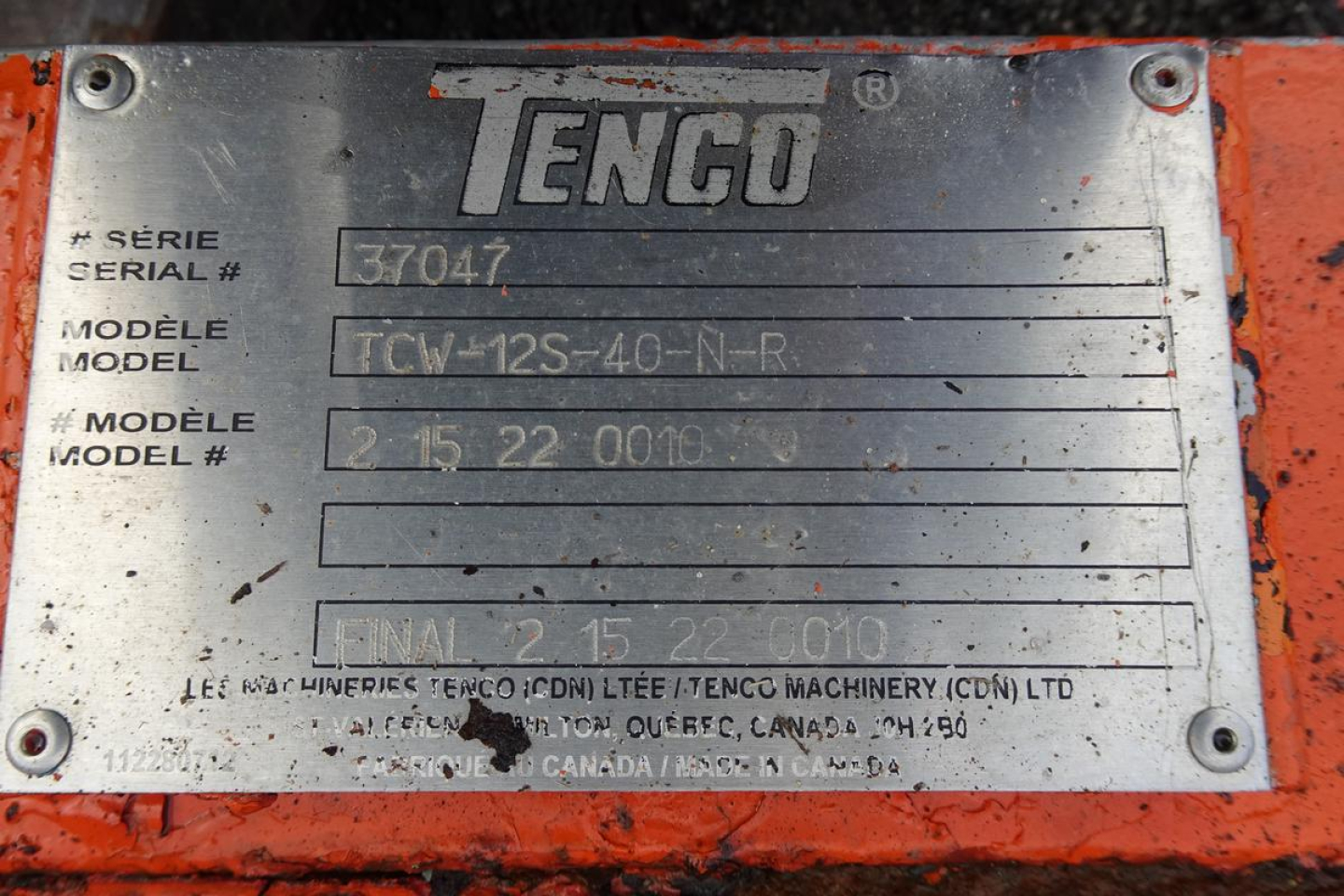TENGO manufacturer plate on orange machinery showing model numbers and serial details.