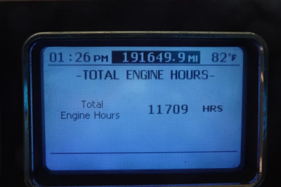 Mack GU713 truck instrument display showing total engine hours 11709 HRS with 01:26 PM and 82F, mileage 191649.9 miles.