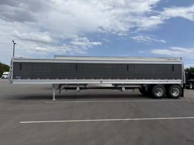 Trailer side view of a 2027 Stoughton 40' aluminum grain hopper with 68" corrugated sidewalls.