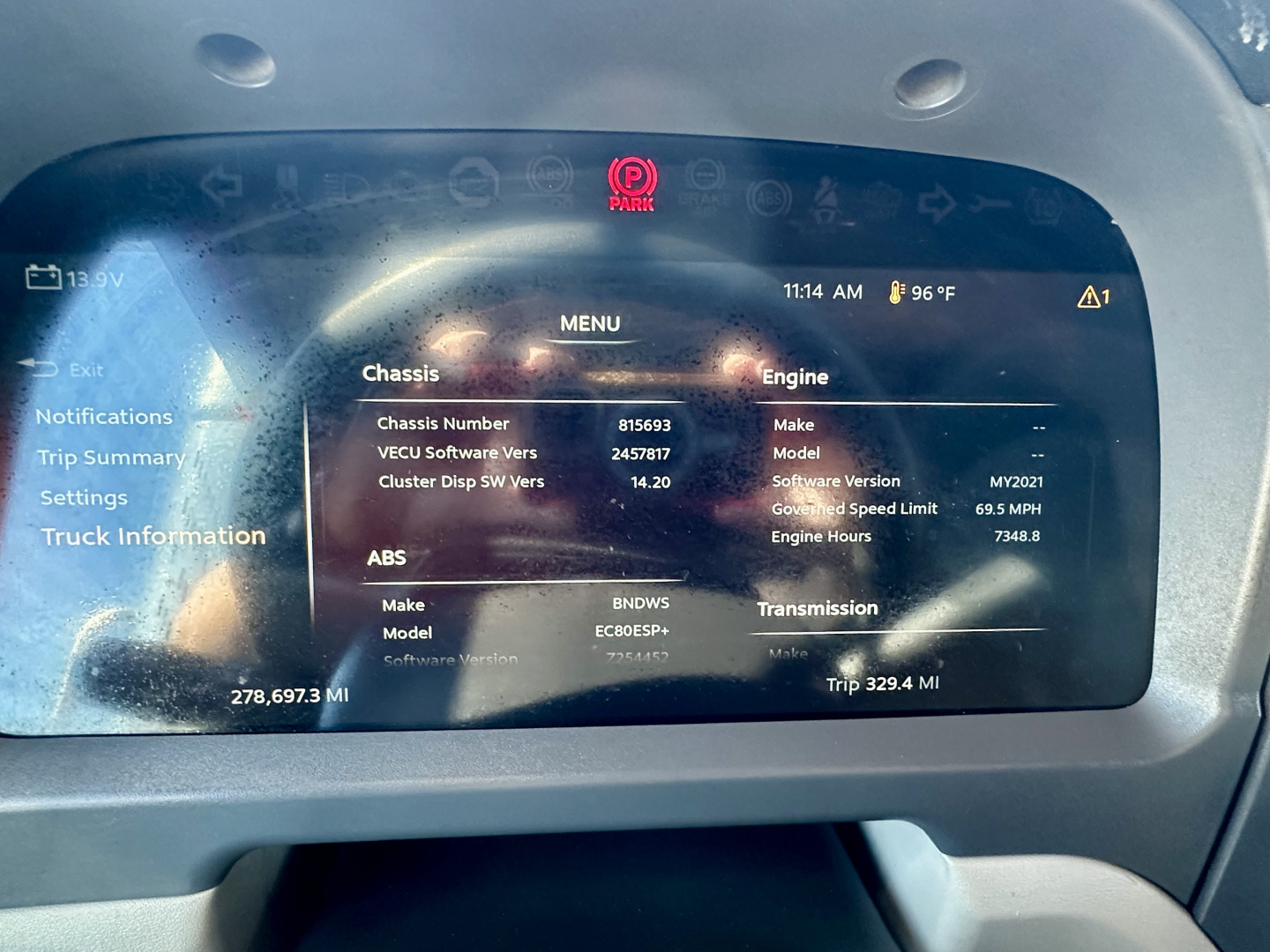 Peterbilt 567 dash touchscreen display showing truck information and electronic instrumentation.
