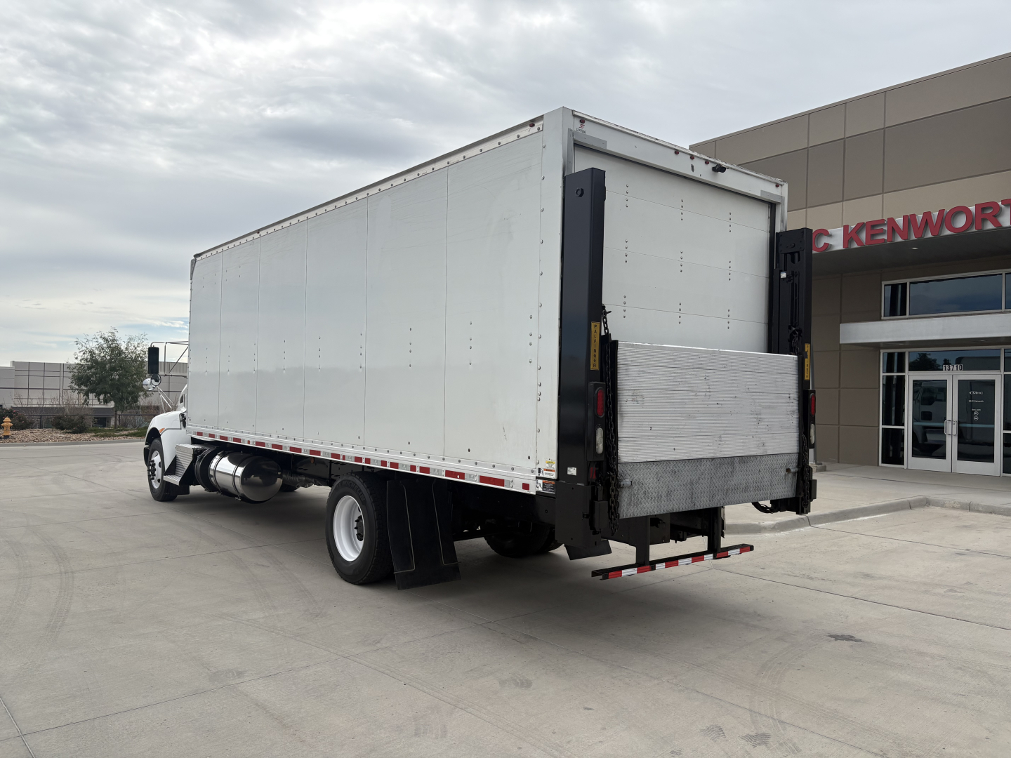 Kenworth T270 box truck rear and side view showing cargo box, rear liftgate, and dual rear wheels.