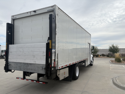 Kenworth T270 box truck rear-side view showing aluminum cargo box and rear underride guard.