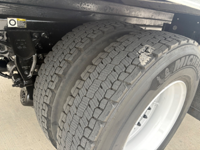 Kenworth T270 truck rear dual tires showing tread and wheel well, with suspension components visible.