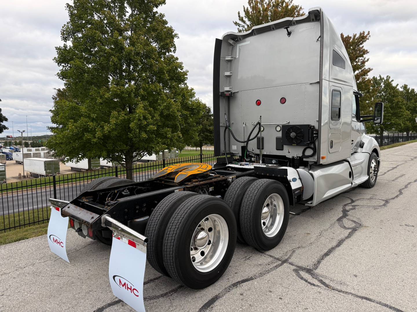 Kenworth T680 double rear axle tractor cab rear view showing chassis and wheels without trailer.