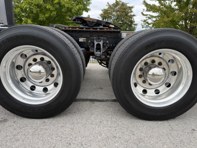 Kenworth T680 chassis with dual rear axles and wheels, showing trailer-axle area.