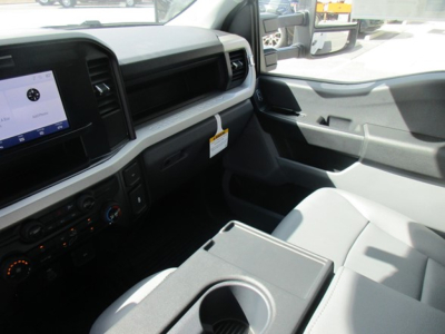 Ford F-350 interior cab front dash view showing center console and cup holder.