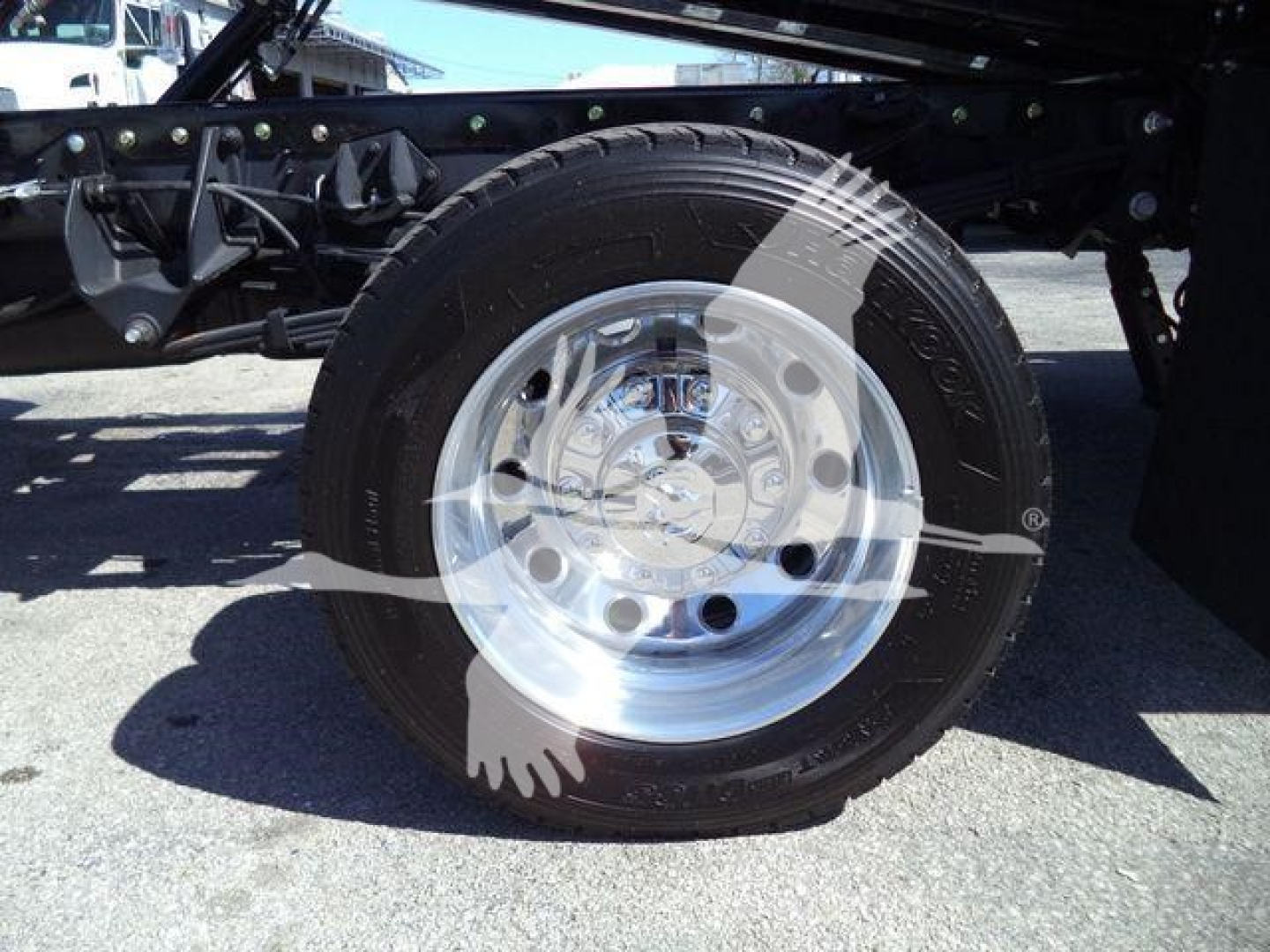 Ram 5500 Big Horn chassis showing front wheel and hub with polished steel rim and tire.
