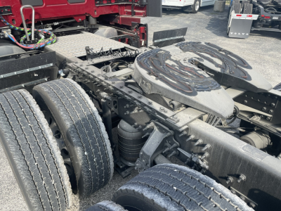 Volvo VNL64T860 chassis view showing rear dual wheels, fifth wheel and mounting components with fuel/air lines and air suspension components visible.