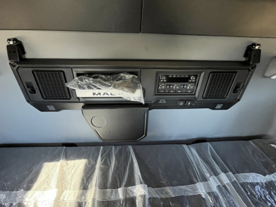Mack PR64T76M dash panel with control cluster and storage pocket in sleeper cab.