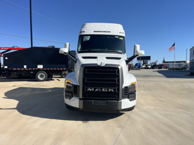 Mack PR64T76M truck front view showing grille and headlights in a dealership lot.