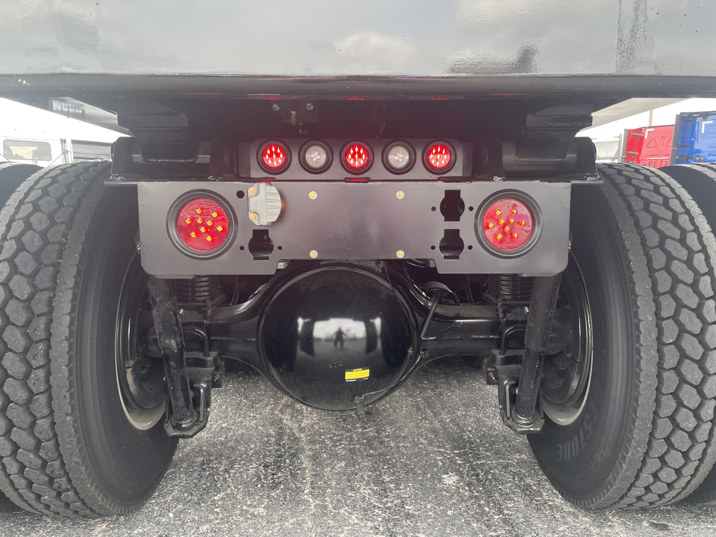 Volvo VHD64F300 rear view showing suspension and rear lights with multiple red LED indicators.