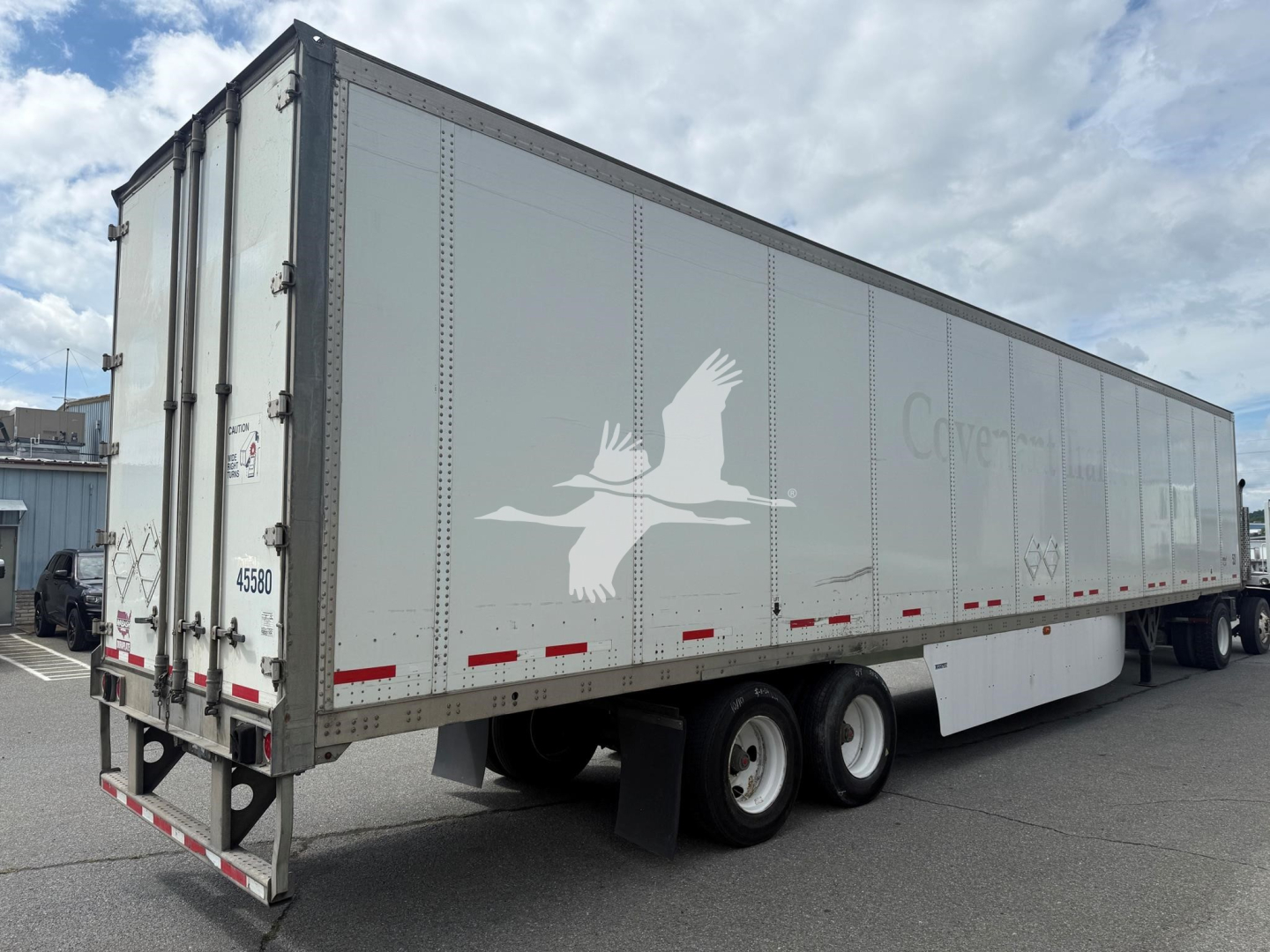 Trailer side view of a 2017 Wabash dry van with silhouette logo and CaSource branding, showing tandem axles and rear doors.