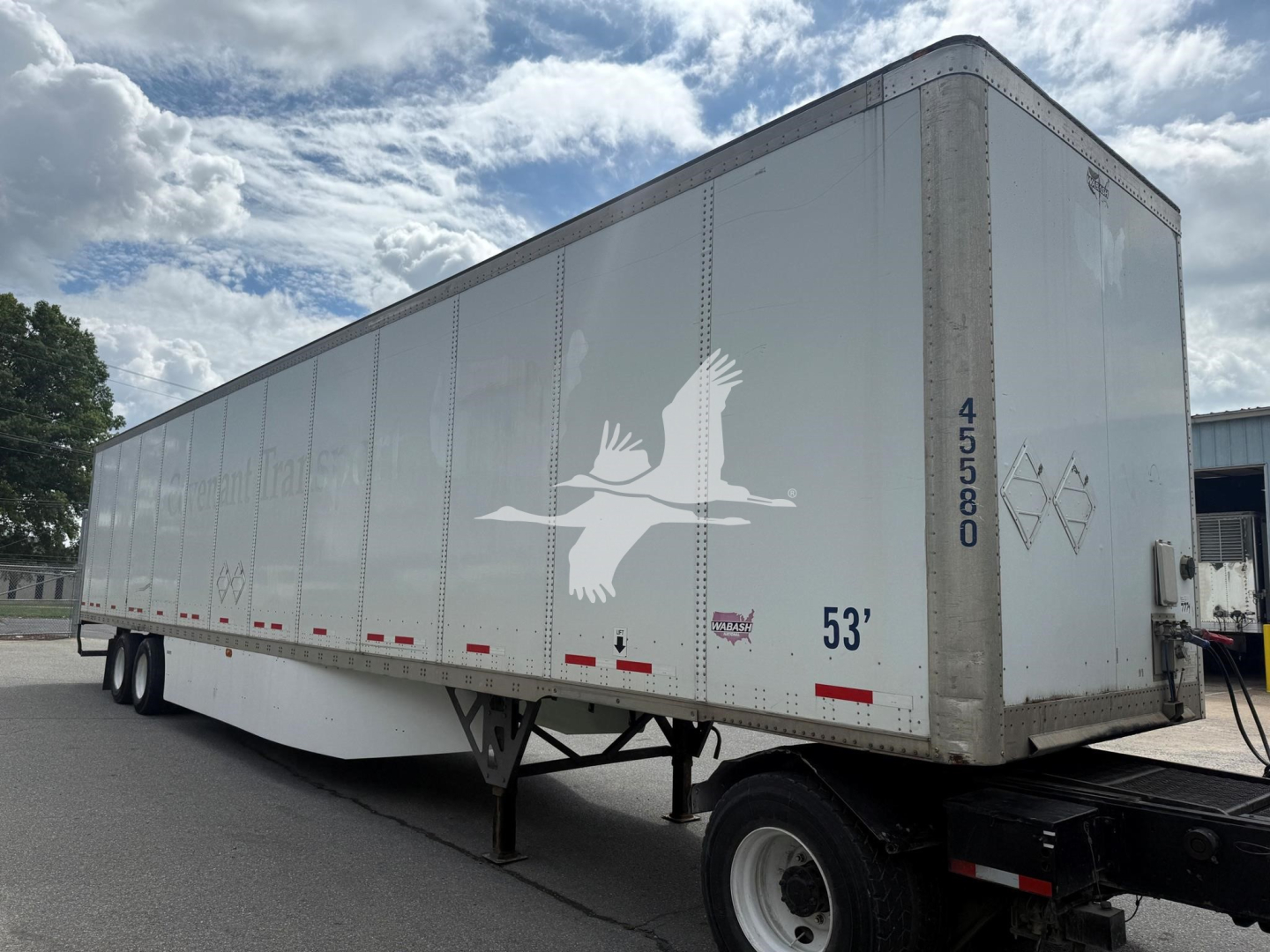 Trailer side view of a 2017 Wabash dry van with a white eagle logo, 53' length, loading marks, and dual axles.