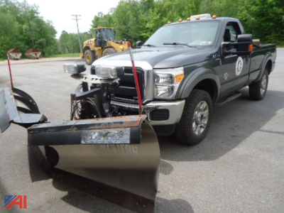 2016 Ford F-350 Super Duty pickup with front plow attachment in a parking lot.