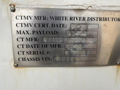 Metal data plate on a 2016 Ford F-750 showing CTMV MFR: White River Distributors, CTMV CERT. DATE: 6/23, MAX PAYLOAD: 10,?8, CT MFR: Trans Master, CT DATE OF MFR: 12/08, CT SERIAL #: LA7710, CHASSIS VIN: 1FDXF7DCXGDA03318