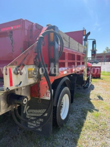 Truck rear side showing hydraulic hoses, dump bed, and Mudflap with text 'AFFENBERGER' and location details.