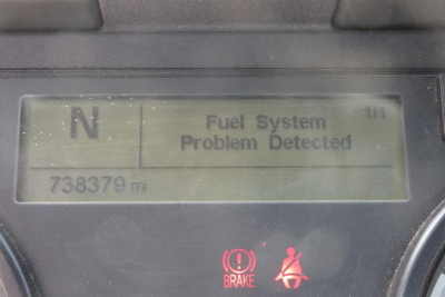 Dashboard display showing 'Fuel System Problem Detected' with 'N' gear indicator and odometer reading 738379 mi.