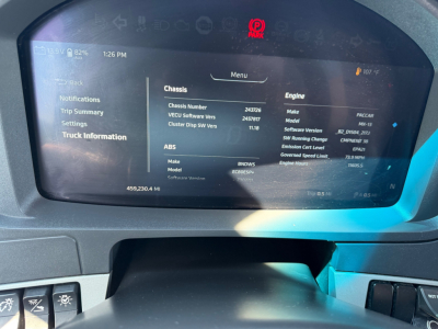 Kenworth T680 interior monitor displaying chassis and engine information in the driver display.
