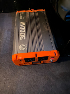 DC-DC 3000W inverter unit with orange end caps, black body, and cooling fins.