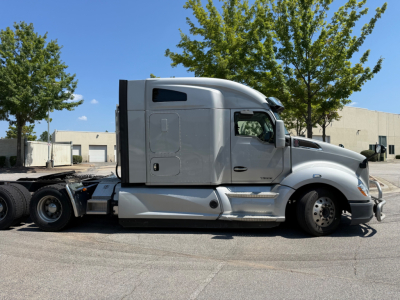 Kenworth T680 truck side view with sleeper cab and fuel tanks. VIN label and stock number not visible.