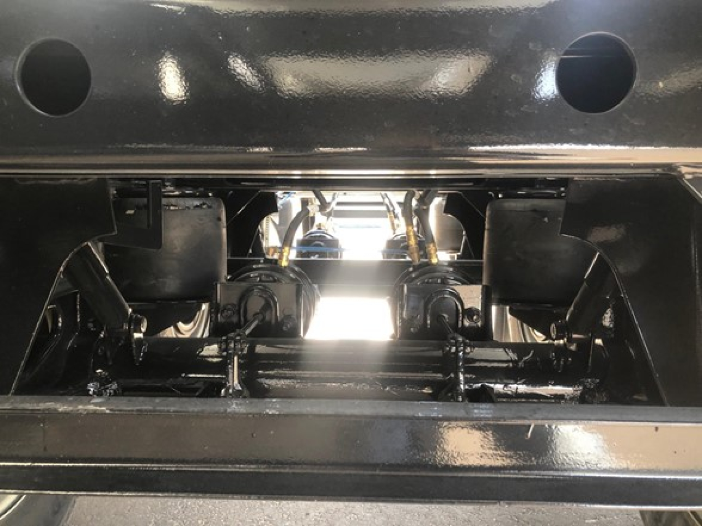 Front view of a 2026 Jet Jet 40' Air Ride Side Dump trailer chassis showing suspension components and axle area.