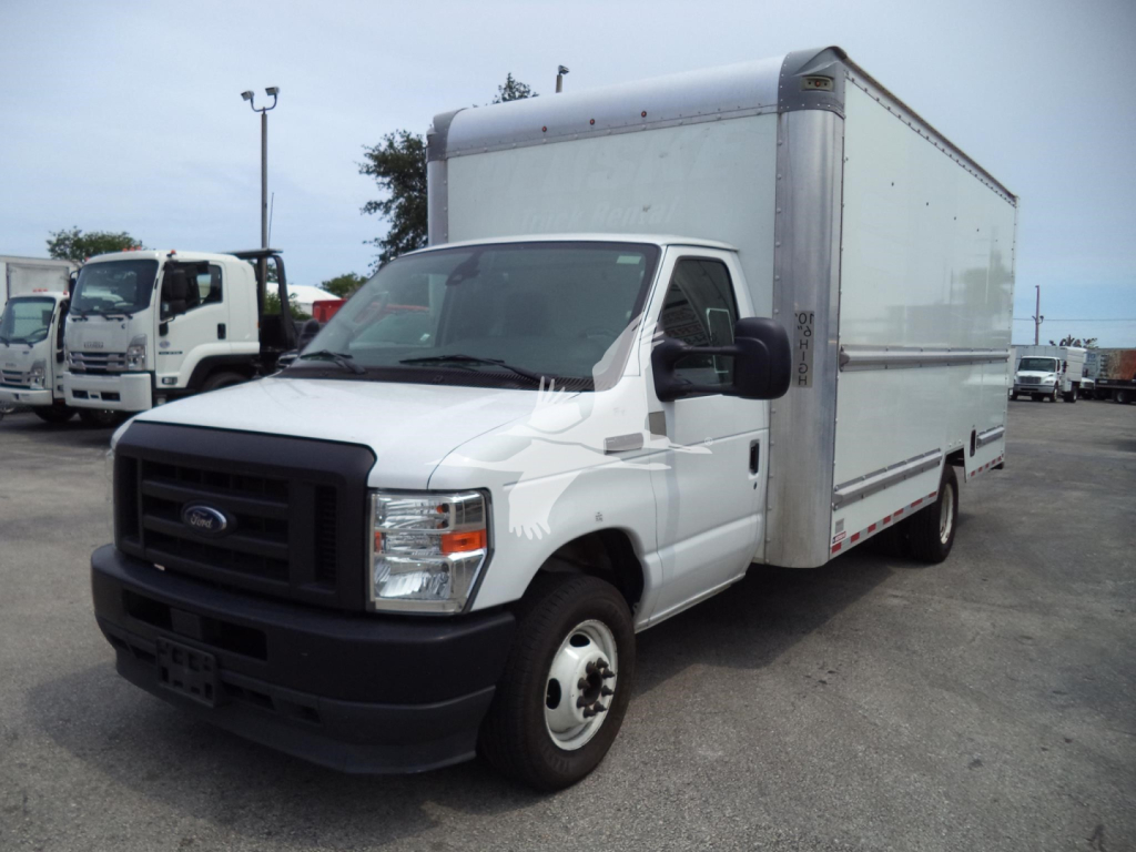 Ford E-350 box truck in white, front-left view showing cargo box and cab with black grille and bumper.