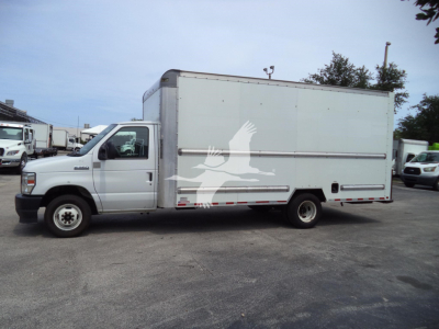 Ford E-Series cutaway box truck in side view with light gray cargo box, cab, and registration details. Visible text includes VIN 1FDWE3FN6NDC03440, stock T03440, category High Cubes / Cutaways, type Trucks, condition Used, model year 2022.