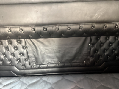 kenworth w900l interior upholstery paneling with tufted black leather, storage pocket visible