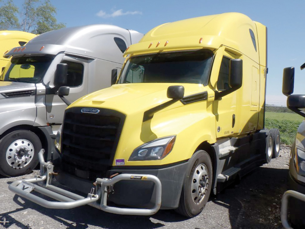 Front view of a yellow Freightliner Cascadia126 sleeper truck showing grille, bumper guard, and side mirrors.