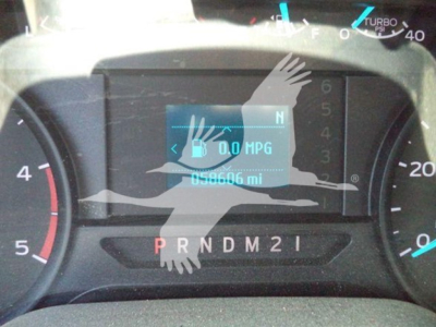 Dashboard of a Ford F-250 showing 0.0 MPG display and odometer reading 58,606 miles with gear shift indicator PRNDM2I.
