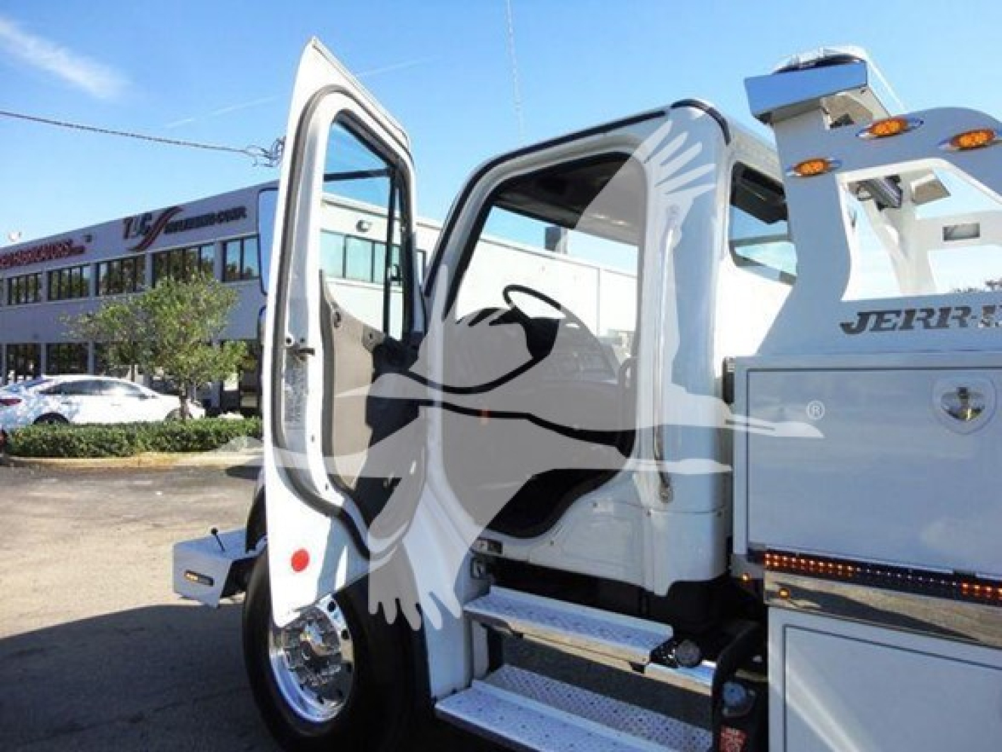 Truck cab area with open door on Freightliner Business Class M2 106 showing steps and interior