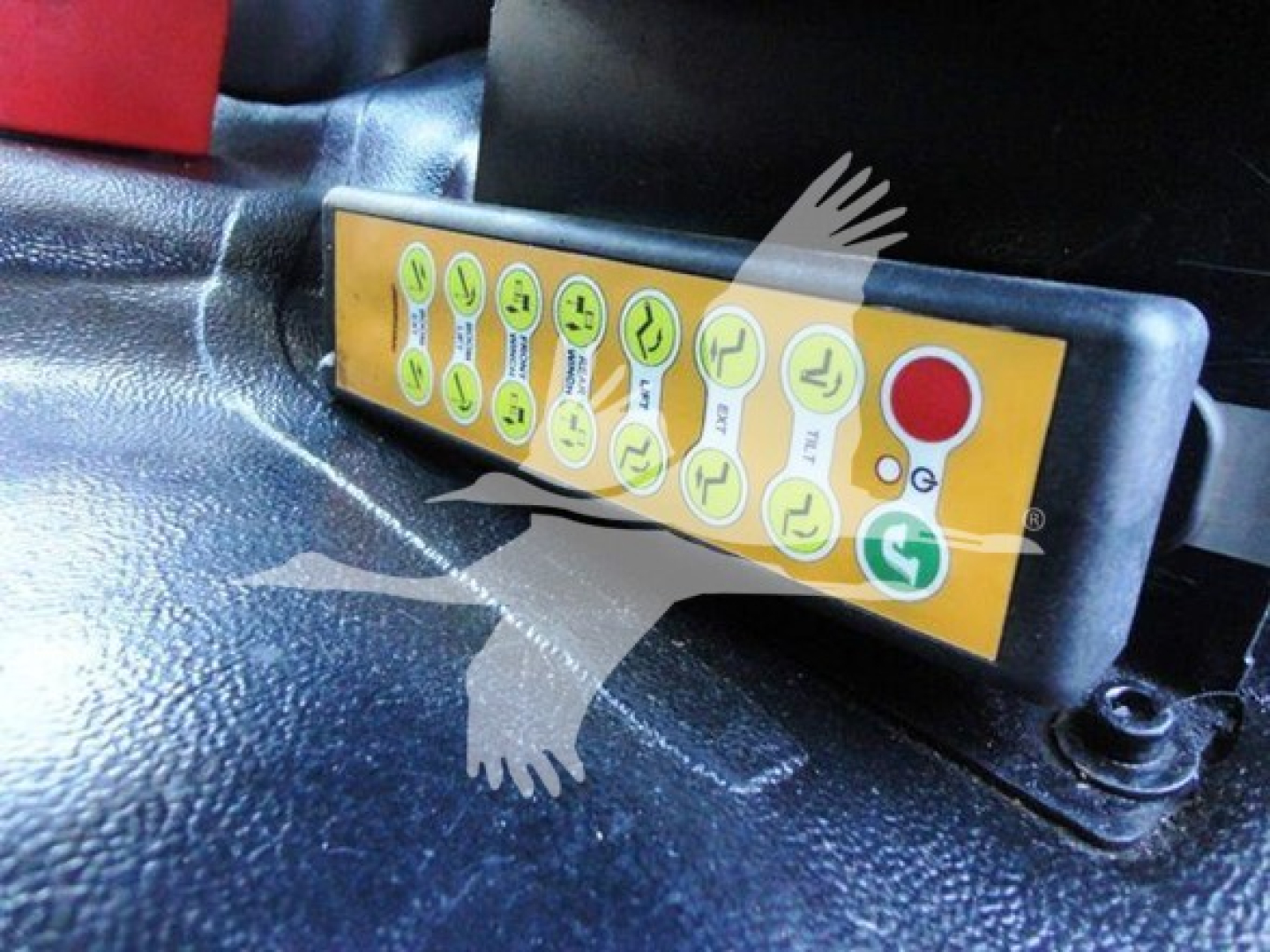 Truck winch control panel with yellow label and green icons mounted on a black surface inside a Freightliner M2 106 cab.