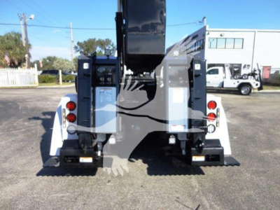 Truck rear view of a 2012 Freightliner Business Class M2 106 winch truck showing rear bumper, taillights, and hitch assembly.
