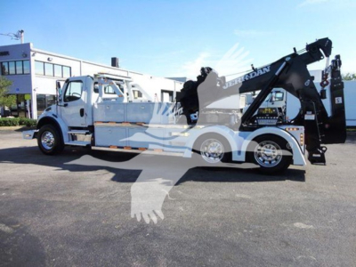 Freightliner Business Class M2 106 tow truck with Jerr-Dan wrecker body and crane, side view.