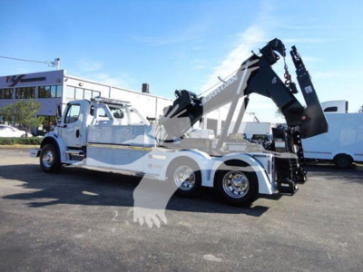 Tow truck with crane/winch equipment mounted on chassis, Freightliner Business Class M2 106 style, side view.