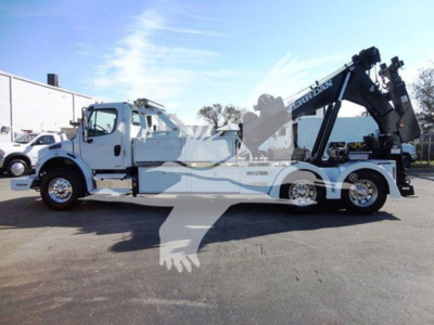 Freightliner Business Class M2 106 wrecker/ tow truck side view showing crane arm and winch