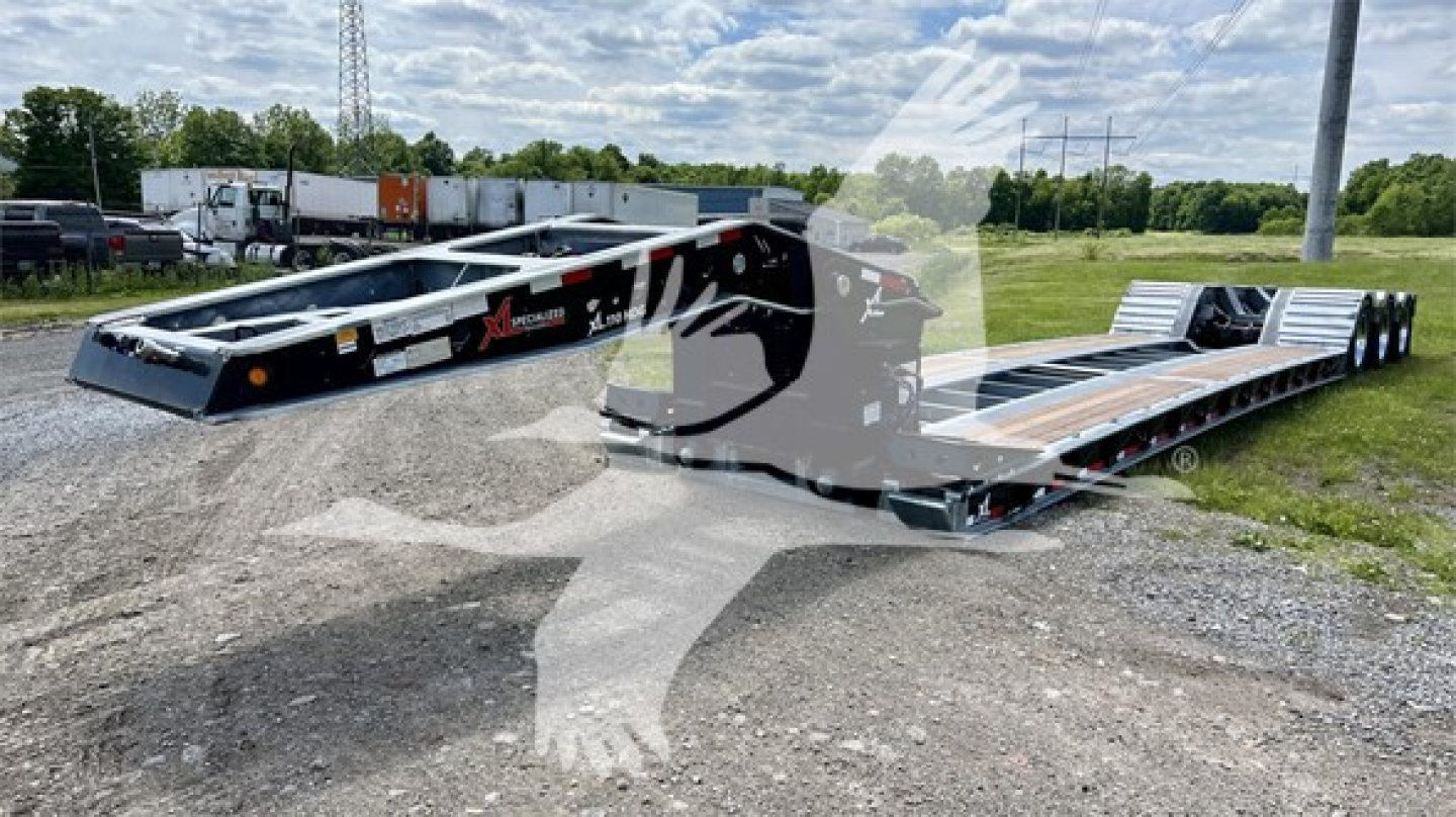 XL Specialized XL110HDGS lowboy trailer showing dual deck with metal frame and branding on side.