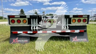 XL Specialized XL110HDGS trailer rear view showing taillights and mudflaps with XL Specialized branding.
