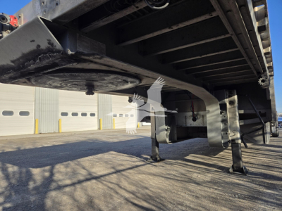 Underbelly of a 2019 Reitnouer Dropmiser trailer showing the frame, landing gear, and underside components.